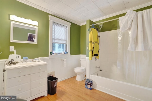 full bathroom featuring toilet, vanity, shower / tub combo, wood-type flooring, and crown molding