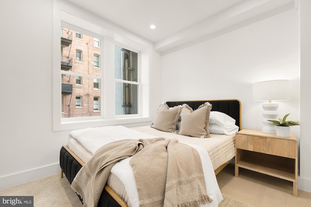 bedroom with multiple windows