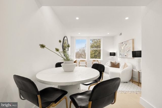 dining area with light wood-type flooring