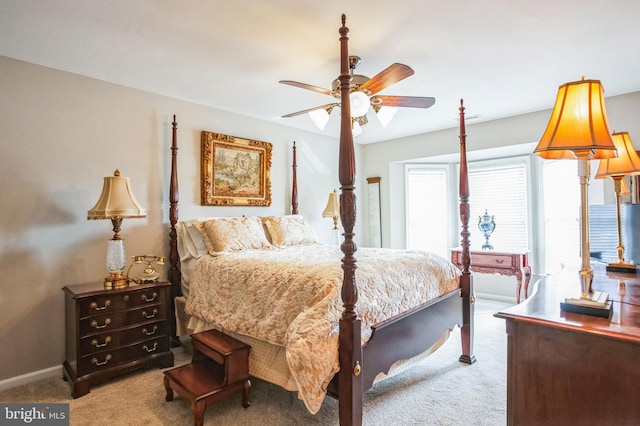 carpeted bedroom with baseboards and ceiling fan