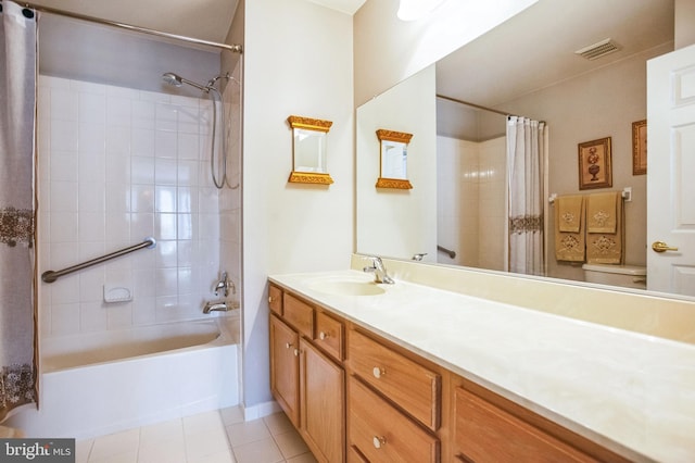 full bath featuring visible vents, toilet, shower / tub combo, tile patterned floors, and vanity