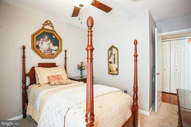 bedroom featuring a closet, baseboards, a ceiling fan, and carpet