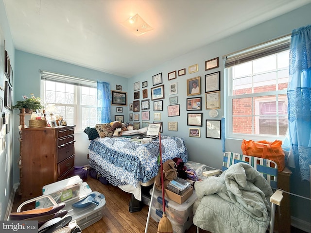 bedroom with wood-type flooring