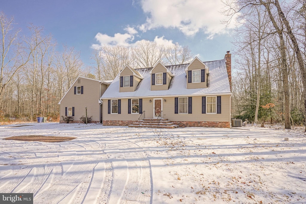 cape cod-style house featuring central AC