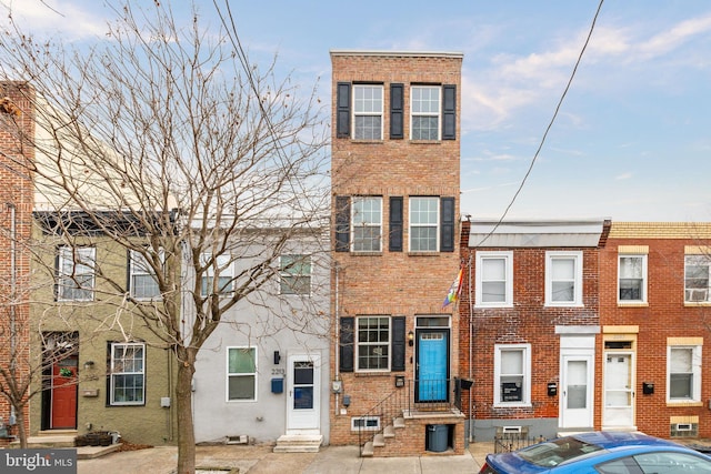 2211 Almond St, Philadelphia, PA 19125 - townhome / multi-family property with entry steps and brick siding