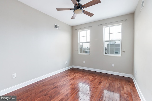 unfurnished room with hardwood / wood-style flooring and ceiling fan