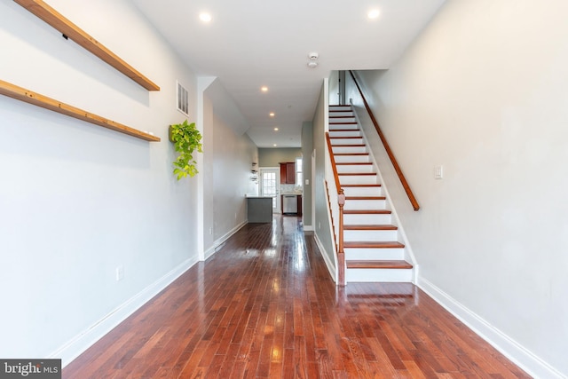 hall with dark hardwood / wood-style flooring