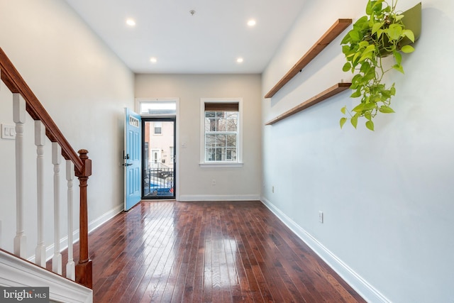 foyer with dark hardwood / wood-style floors