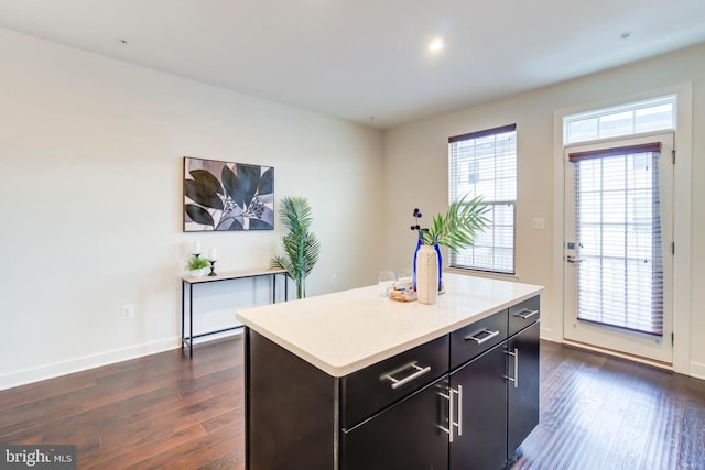 kitchen featuring a center island and dark hardwood / wood-style floors