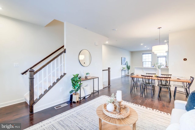 living room featuring dark hardwood / wood-style flooring