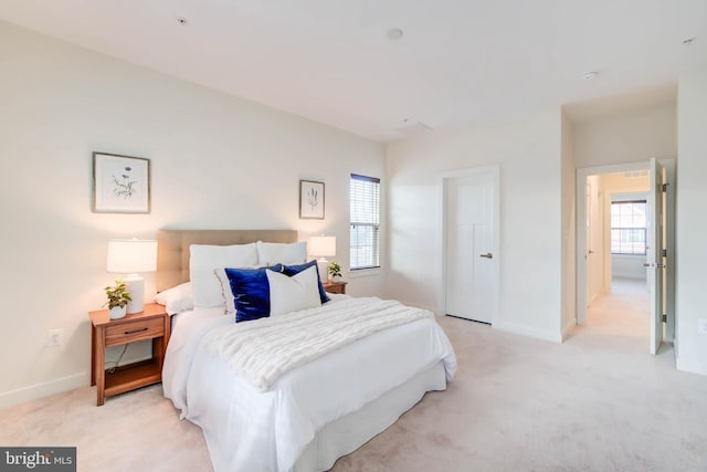 bedroom with light colored carpet