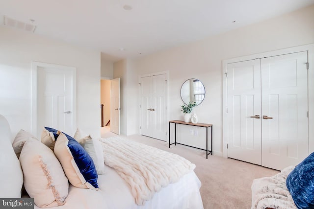 carpeted bedroom featuring a closet