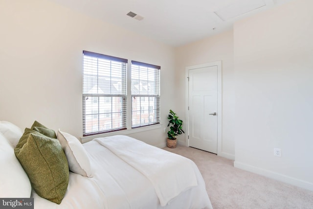 bedroom with light colored carpet