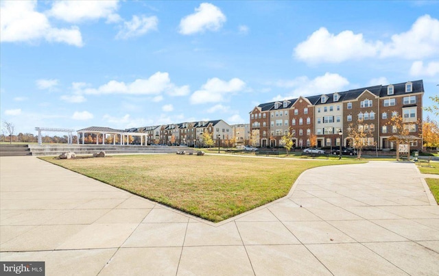 view of property's community with a gazebo and a yard