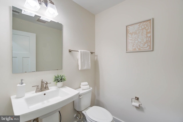 bathroom with sink and toilet