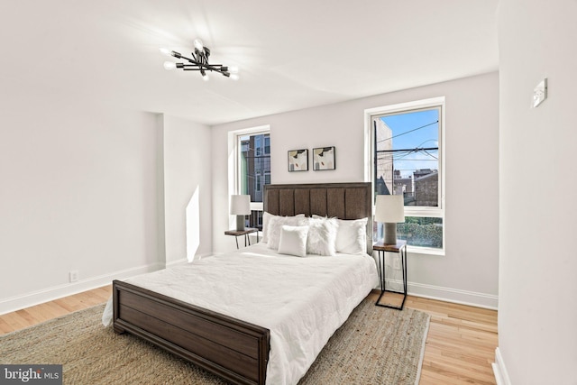 bedroom with light hardwood / wood-style floors