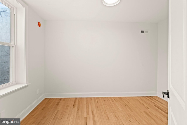 unfurnished room featuring light hardwood / wood-style flooring