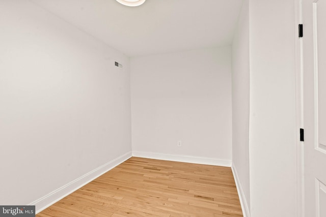 spare room featuring hardwood / wood-style flooring