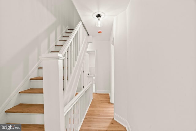 staircase featuring hardwood / wood-style floors