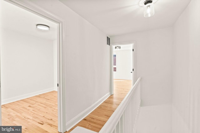 hallway with wood-type flooring