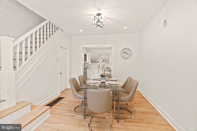 dining area featuring light wood-type flooring