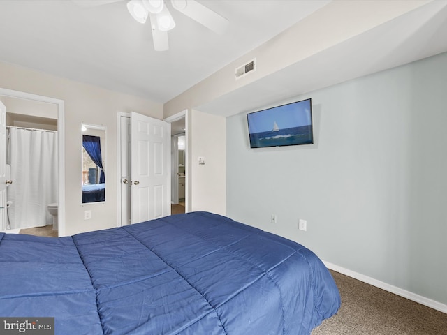 carpeted bedroom featuring ensuite bathroom and ceiling fan