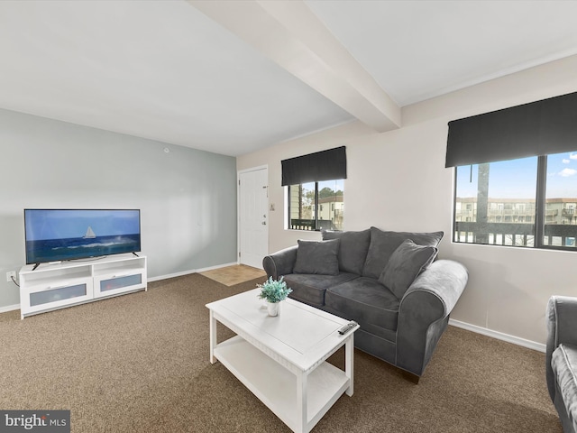 living room with dark carpet and beam ceiling