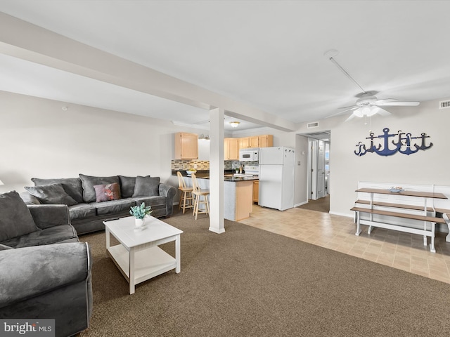 living room with light carpet and ceiling fan