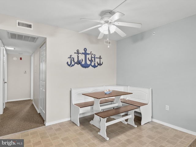 dining space featuring ceiling fan