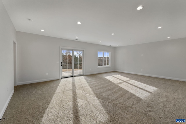 empty room with light colored carpet