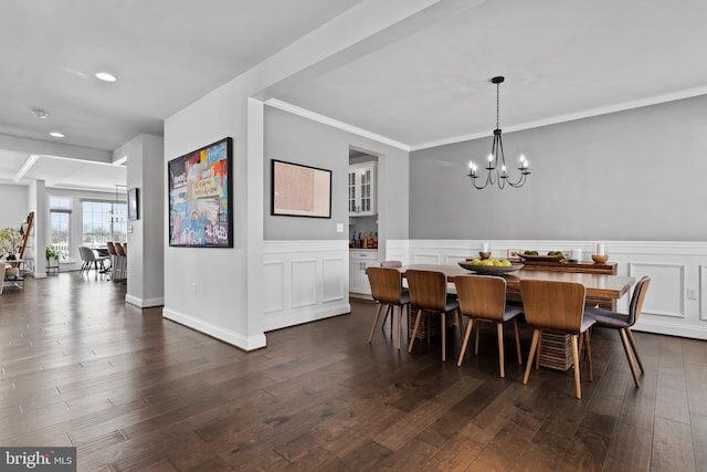 1335 Ashton Rd, Mechanicsburg, PA 17055 - dining area with ornamental molding, an inviting chandelier, dark wood-style floors, a wainscoted wall, and a decorative wall
