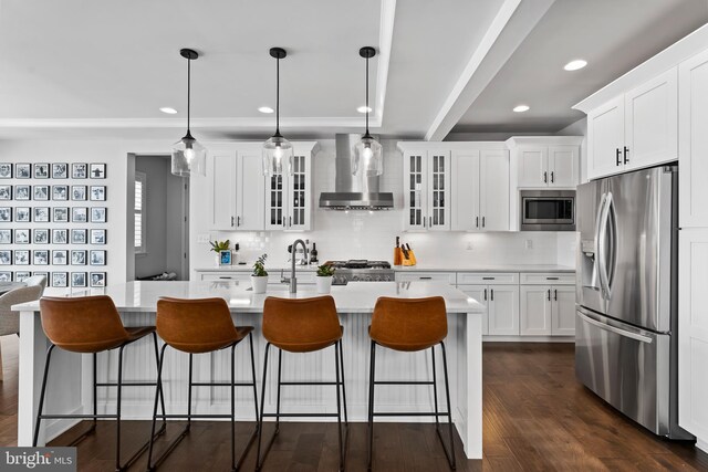 1335 Ashton Rd, Mechanicsburg, PA 17055 - kitchen featuring tasteful backsplash, glass insert cabinets, wall chimney range hood, light countertops, and stainless steel appliances