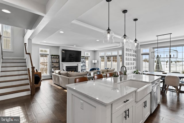 1335 Ashton Rd, Mechanicsburg, PA 17055 - kitchen featuring a sink, recessed lighting, white cabinetry, a lit fireplace, and light stone counters
