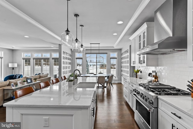 1335 Ashton Rd, Mechanicsburg, PA 17055 - kitchen featuring recessed lighting, high end stainless steel range, wall chimney exhaust hood, and a sink