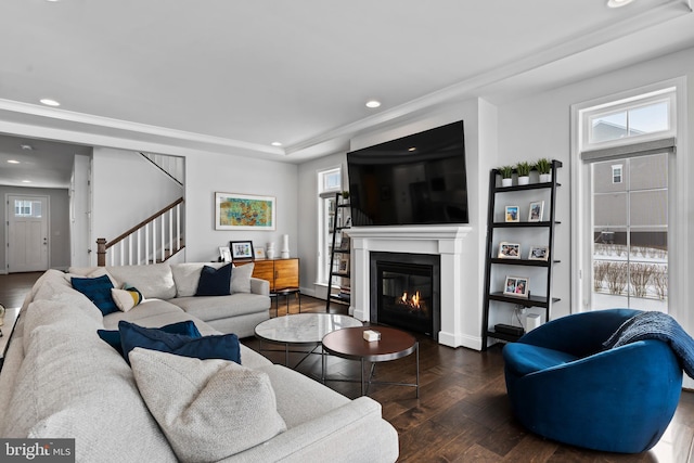 1335 Ashton Rd, Mechanicsburg, PA 17055 - living room featuring a tray ceiling, a glass covered fireplace, stairway, recessed lighting, and hardwood / wood-style floors