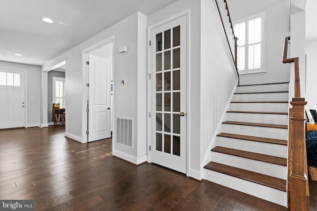1335 Ashton Rd, Mechanicsburg, PA 17055 - foyer entrance with dark wood-style flooring, visible vents, baseboards, and stairs