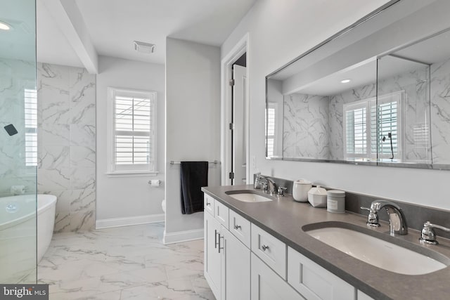 1335 Ashton Rd, Mechanicsburg, PA 17055 - full bath with a soaking tub, marble finish floor, a sink, and visible vents