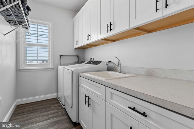 1335 Ashton Rd, Mechanicsburg, PA 17055 - laundry room with baseboards, a sink, dark wood-style flooring, independent washer and dryer, and cabinet space