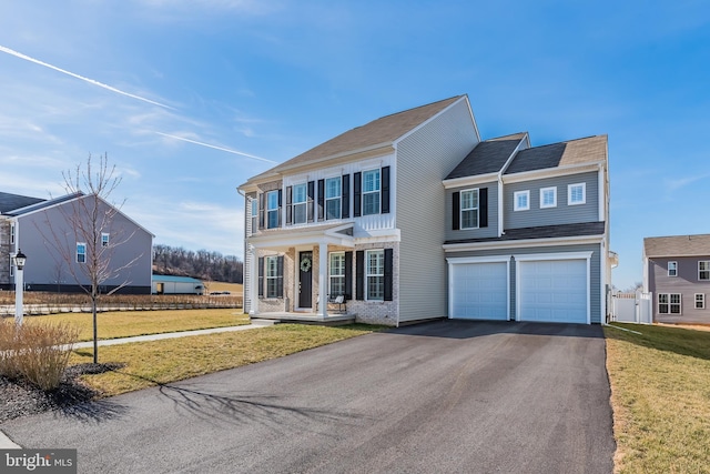 1335 Ashton Rd, Mechanicsburg, PA 17055 - view of front facade featuring a front yard, a garage, and driveway