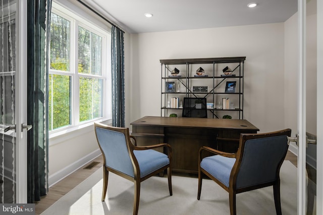 office area with light hardwood / wood-style floors