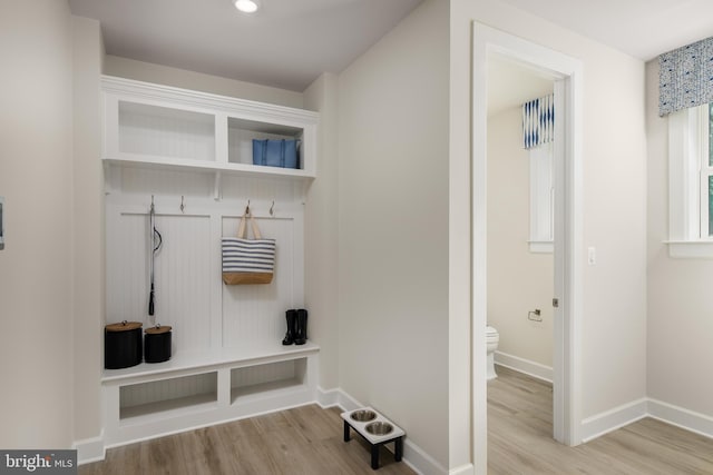 mudroom with light hardwood / wood-style flooring