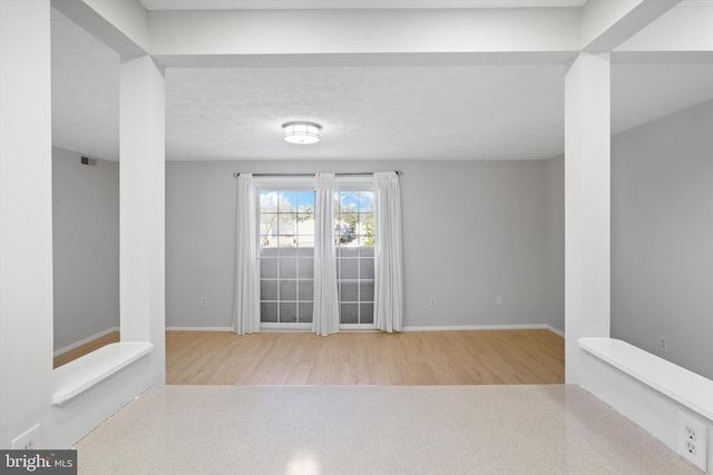 spare room with light wood-type flooring