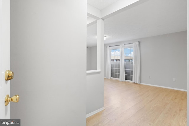 unfurnished room featuring light wood-type flooring