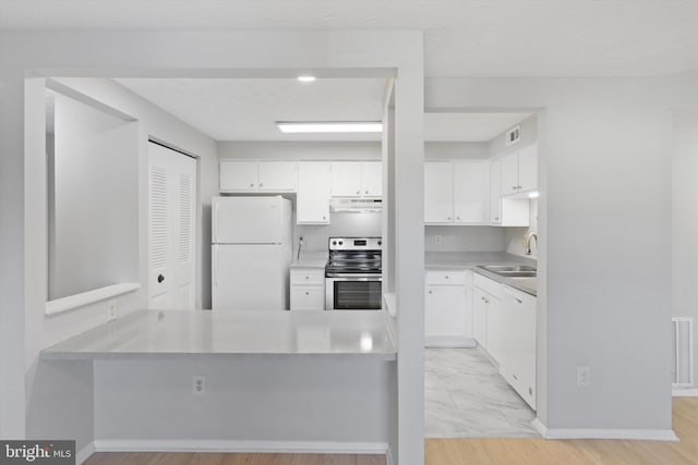 kitchen with white cabinetry, sink, and white appliances