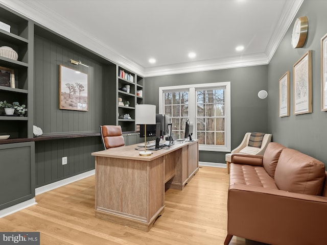 office space with ornamental molding, built in shelves, light wood-style flooring, and recessed lighting