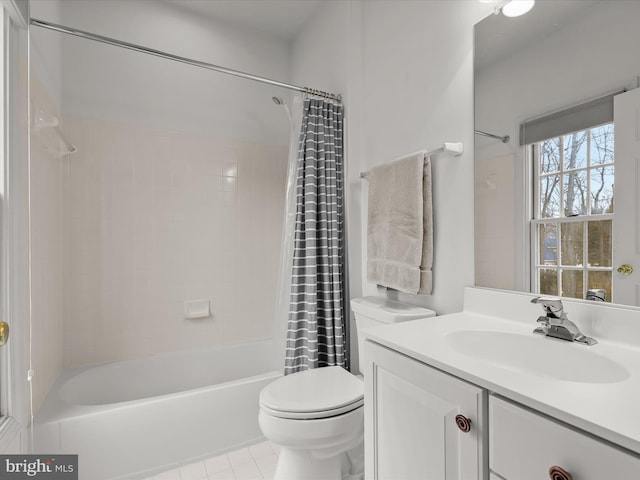 full bathroom featuring tile patterned flooring, shower / tub combo with curtain, vanity, and toilet