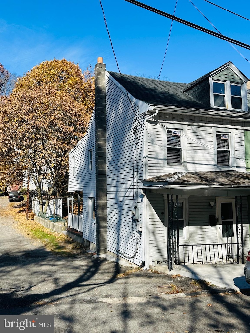 view of property exterior featuring covered porch