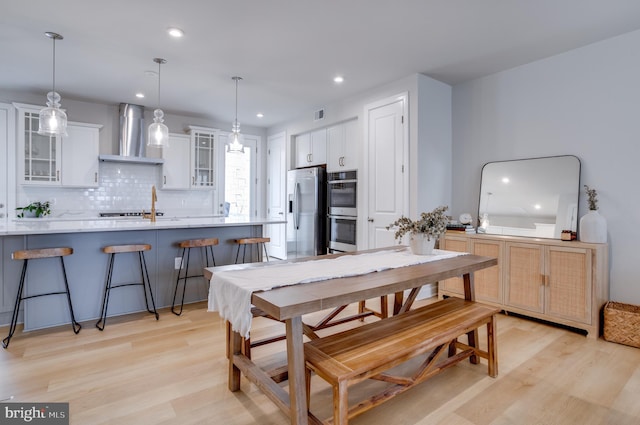 dining space featuring light hardwood / wood-style floors