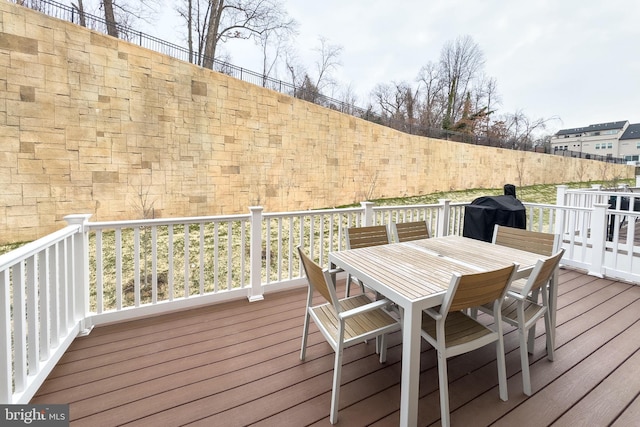 wooden deck with grilling area