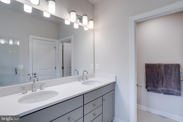 bathroom with tile patterned floors and vanity